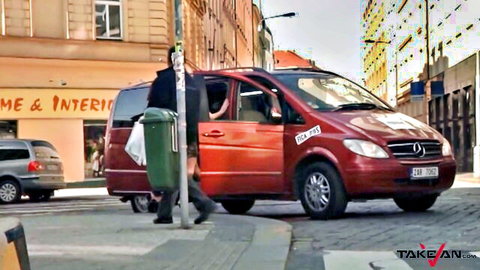 Sexy woman in black stockings climbs into red Mercedes van on busy street for public pickup