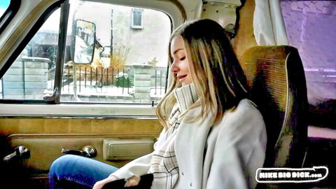 Blonde woman smiling eyes closed in van passenger seat teasing big dick suck