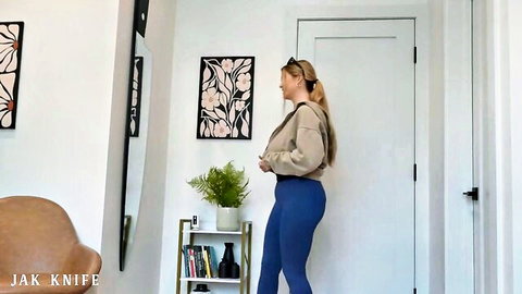 Angie Faith blonde with large natural tits in tight blue leggings and hoodie tease