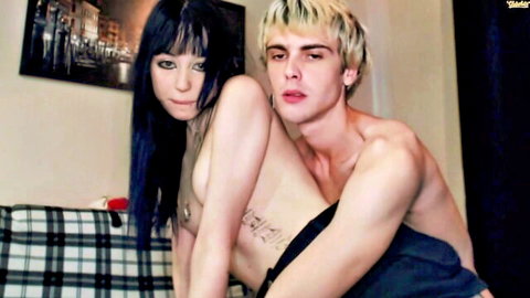 Skinny pale woman with black hair and blonde man topless embrace in amateur stream