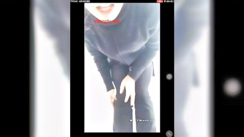 Skinny Chinese woman squats low in tight black pants during live amateur cam show