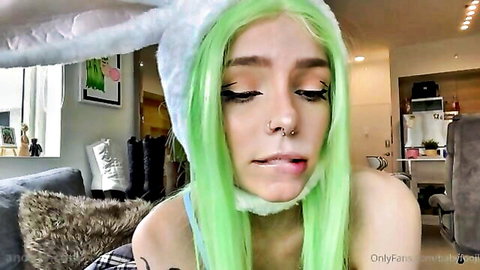 Babyfooji in green wig and bunny ears, teasing with tongue out