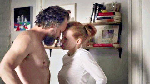 Jessica Chastain in intimate forehead touch with shirtless man in Memory (2023)