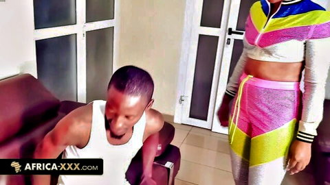 African training coach and client in sexy athletic gear tease on couch