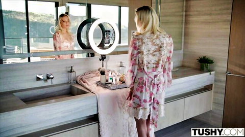 Blonde influencer Kenna in sheer lace robe teases audience