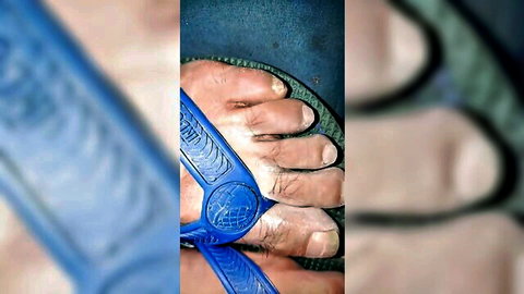 Close-up of hairy male feet in blue flip flops, foot fetish thumbnail