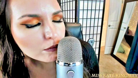 Miss Kate Kingsley glossy lips kissing microphone in seductive ASMR JOI tease