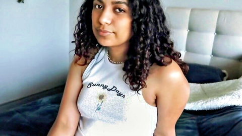 Curly-haired Latina teen in Sunny Days tank top posing casually