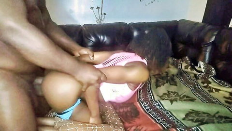 Muscular black guy fucks curvy ebony babe doggy style on couch