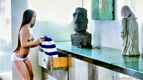Topless brunette with small tits bends over in white panties pulling striped towel from drawer