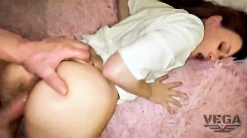Asian woman in white shirt getting touched intimately from behind on bed