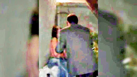 Couple embracing outdoors, woman in blue dress losing virginity