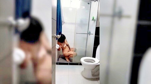 Asian woman solo masturbating in bathtub, small tits exposed