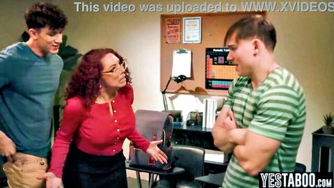 Older redhead MILF with large breasts double penetrated by students