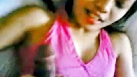 Asian woman in pink top giving blowjob on honeymoon vacation