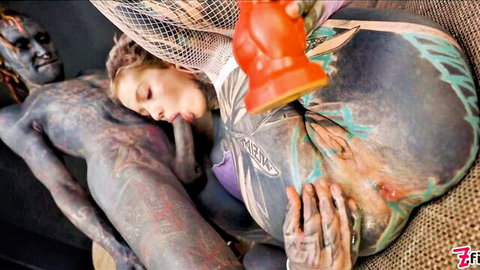 Fair-skinned blonde in fishnets deepthroats massive orange dildo beside heavily tattooed black man