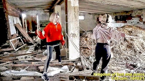 Blonde lezdom duo in spit fetish scene, casual hoodies in ruins