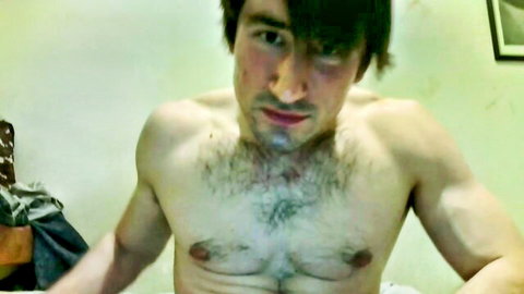 Muscular shirtless man with dark hair and chest hair in gay hardcore preview