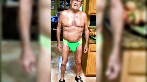 Amateur mature dad posing in tight green speedo