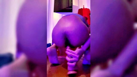 Shemale Shelby Gasser bent over using huge purple dildo anally