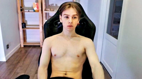 Shirtless Alex Gotcha, slim young man posing solo in chair