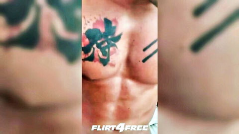 Tattooed buff hunk Richie Grey flexing muscular chest and abs