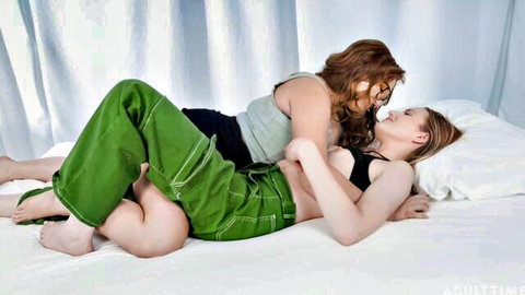 Scarlett Sage and Leana Lovings in intimate lesbian embrace