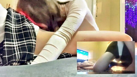 Redhead in plaid skirt edging boyfriend's cock while he plays Super Mario Bros