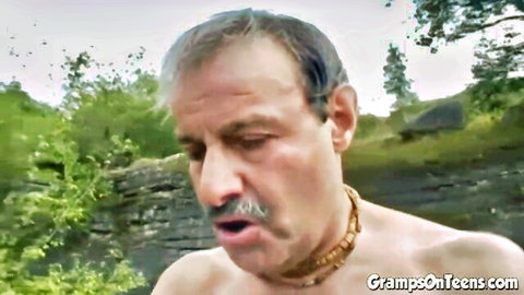 Older mustached man bare-chested outdoors, craving teen action