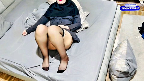 Hijab Persian babe spreads stockinged legs wide teasing on bed