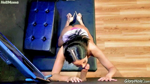 Anissa Kate on all fours in pink lingerie sucking big black cock through gloryhole
