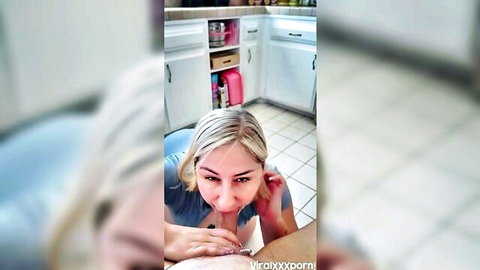 Young blonde on knees sucking cock in kitchen POV with hand stroking shaft
