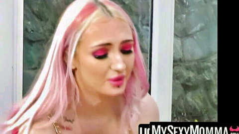Pink-haired Ella Bella seductive close-up in lesbian dildo play