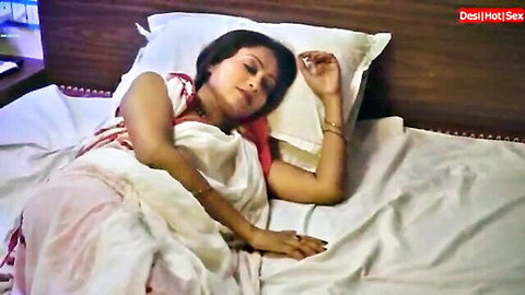 Desi Indian woman in saree lying on bed, sweet boobs play tease