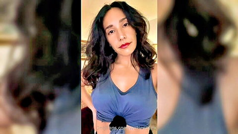 Sexy Latina woman in tight tank top showing cleavage for ASMR