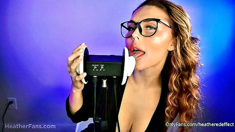 Brunette babe with glasses and big tits licks microphone teasingly in ASMR solo