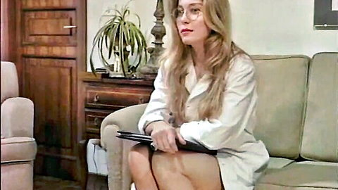 Moana Pozzi as sexy business woman in open white blouse and short skirt