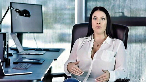 Angela White in open white blouse teasing cleavage in office scene