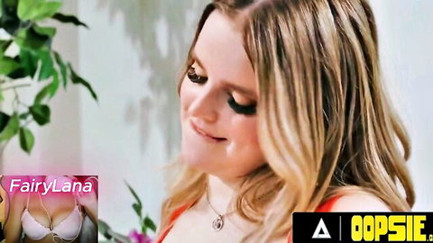 FairyLana blonde trans model in red lingerie smiling seductively