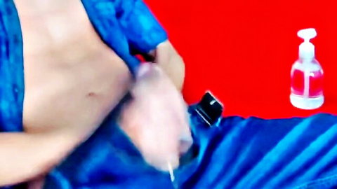 Muscular guy stroking his huge cock in open blue robe handjob