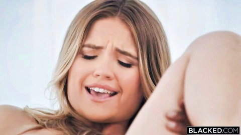 Angie Faith blonde bombshell giving intense blowjob in Blacked interracial scene