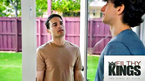 Two fit Latino men in t-shirts flirt outdoors for Filthy Kings blowjob scene