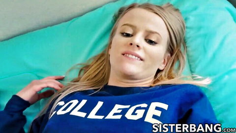 Blonde stepsister Paris White lounging in college hoodie, teasing smile