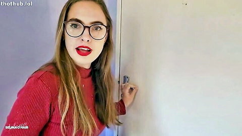 Seductive blonde Selina in glasses and red turtleneck teasing by door