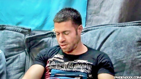 Tristan Jaxx handsome bearded man in black t-shirt, thoughtful gaze