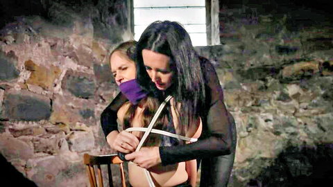 Lesbian bondage game with ropes and purple gag for humiliation excitement