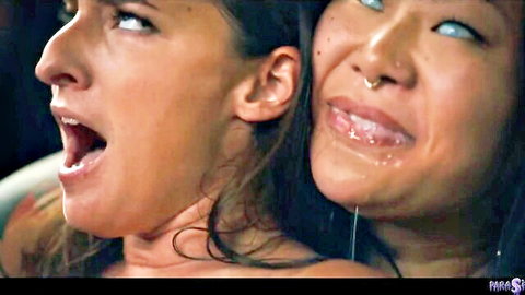 Amirah Adara and Connie Perignon intense close-up in Parasited fetish scene