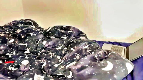 Rumpled starry moon bed sheets with open laptop for webcam solo tease