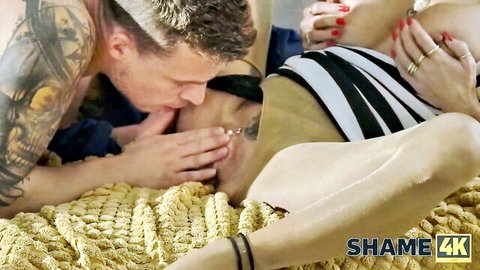 Tattooed man kissing nude woman's body in passionate bed scene, SHAME4K HD