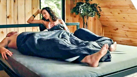 Aleksandra Popławska in teasing robe with muscular man in bed